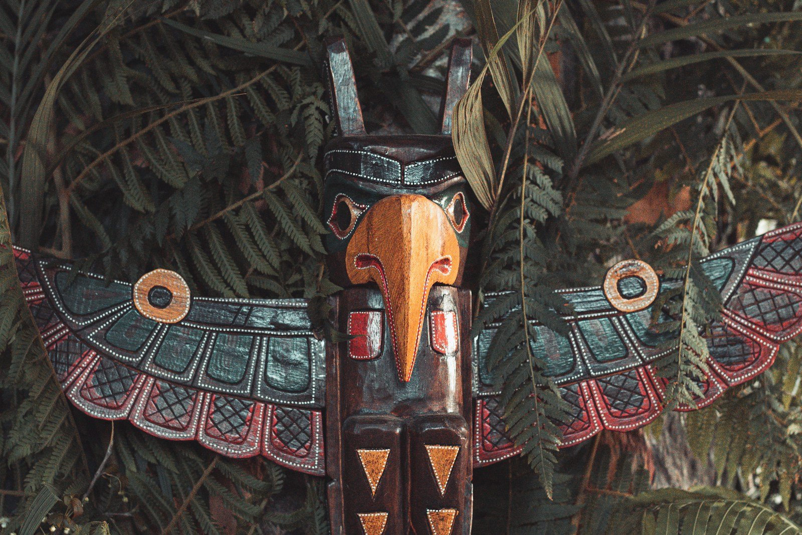 brown and multicolored wooden bird decor